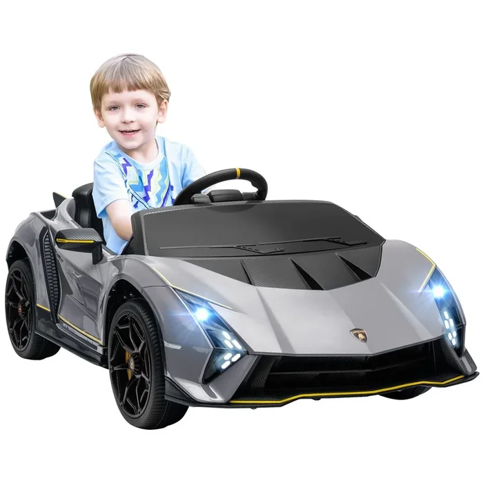 AIYAPLAY Coche Eléctrico para Niños de +3 Años Lamborghini Autentica 2 Motores Potentes Coche Eléctrico con Batería 12V Velocidad 3-5 km/h Mando a Distancia 2,4G Faros Bocina Arranque Suave y MP3 Gris